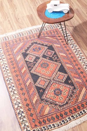 Light pink vintage carpet with intricate bronze designs by Carpet Cellar