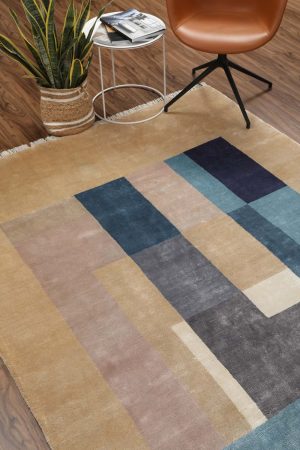 Beige and blue architecture-inspired designs on a modern carpet by Carpet Cellar