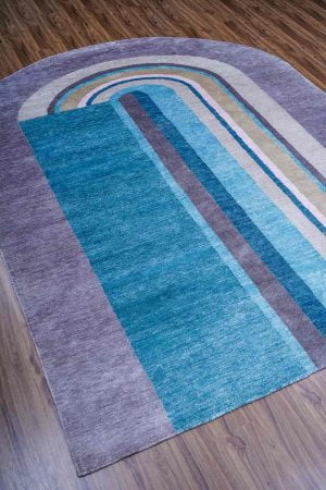 Arc-like patterns in shades of blue and grey on a modern carpet by Carpet Cellar