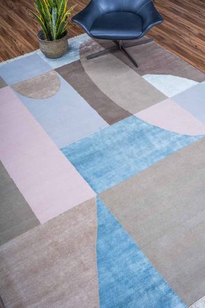 Multi coloured asymmetrical patterns on a beige modern carpet by Carpet Cellar