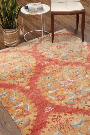 Orange and mustard Arabesque vine patterns on a transitional carpet by Carpet Cellar