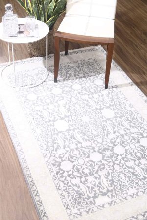 Large beige motifs on a grey transitional carpet by Carpet Cellar