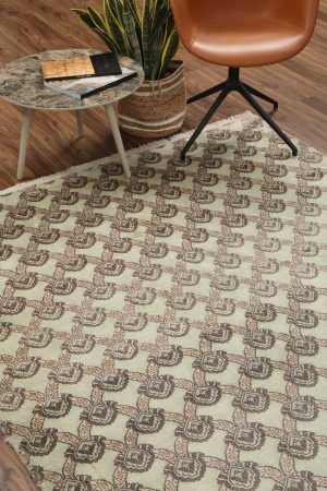 Brown and pink motifs repeated on a beige transitional carpet by Carpet Cellar