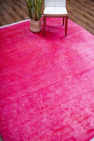 Bright pink modern carpet with white fringed borders by Carpet Cellar